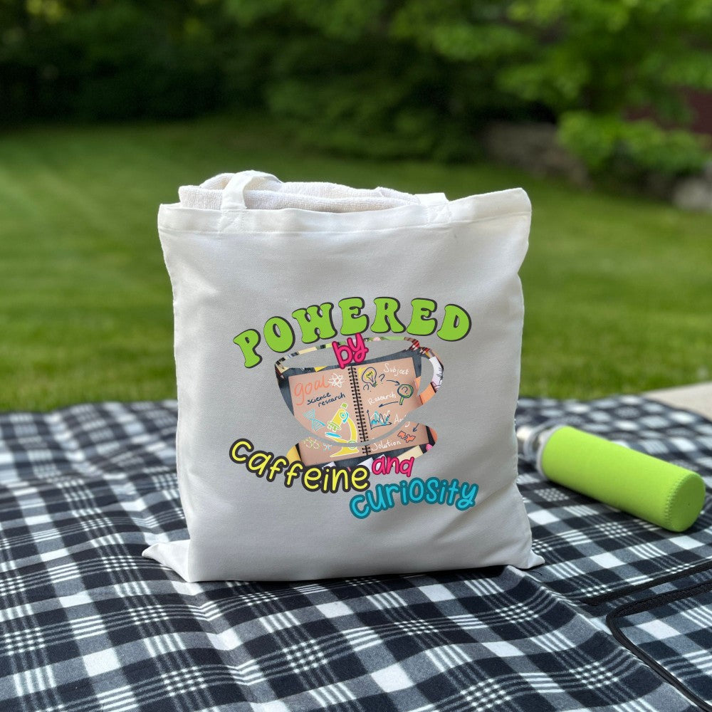 Powered by Coffee and Curiosity โ๐ Canvas Tote Bag