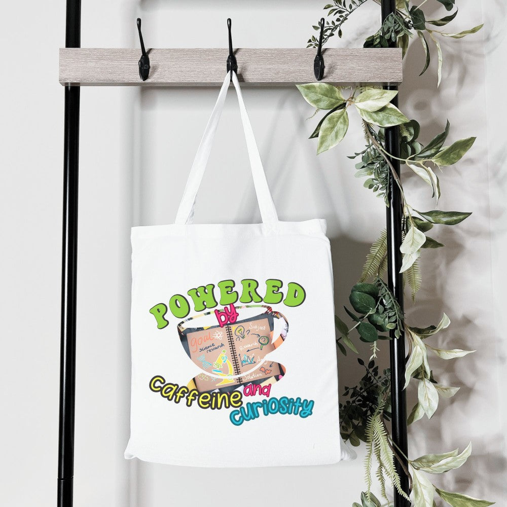 Powered by Coffee and Curiosity โ๐ Canvas Tote Bag