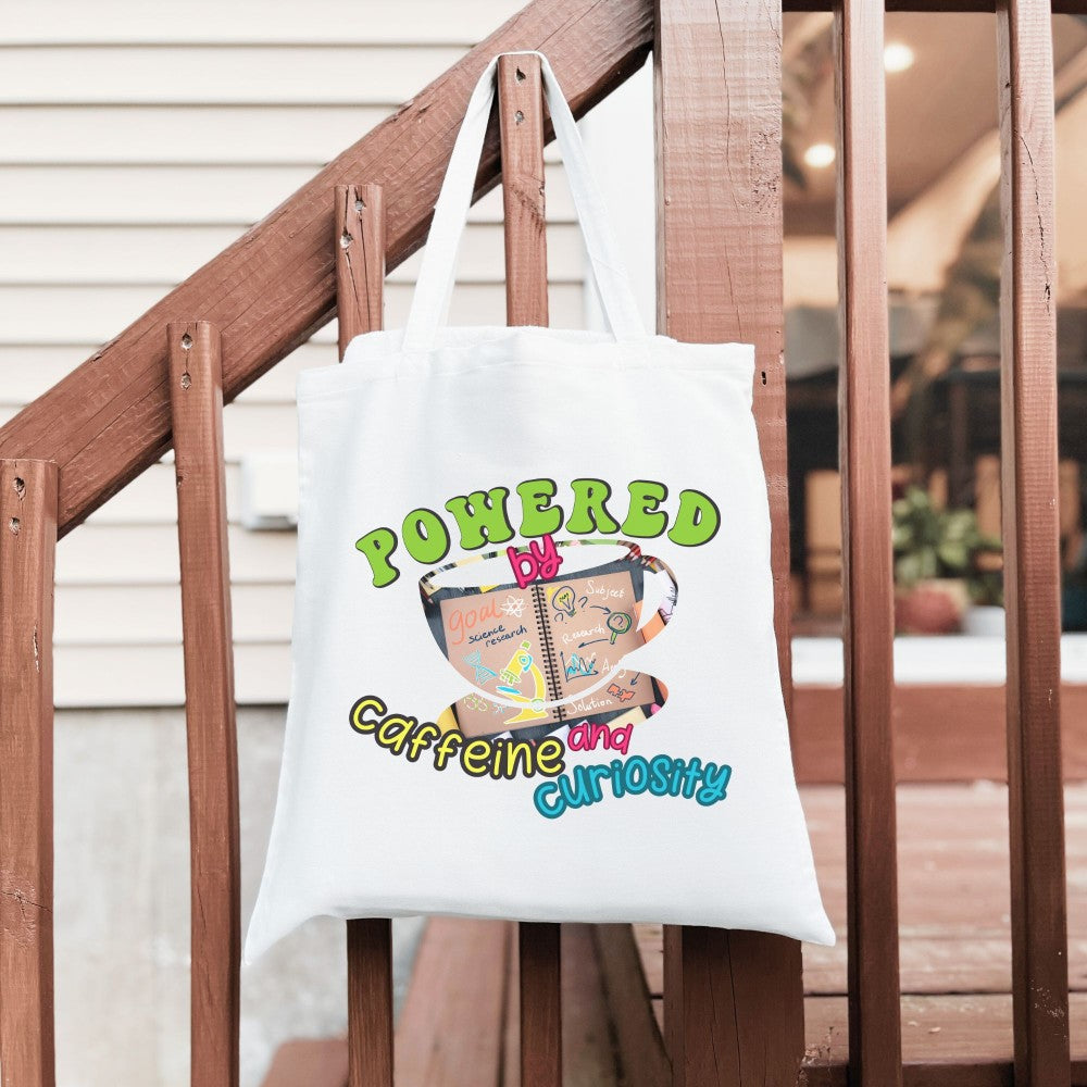 Powered by Coffee and Curiosity โ๐ Canvas Tote Bag