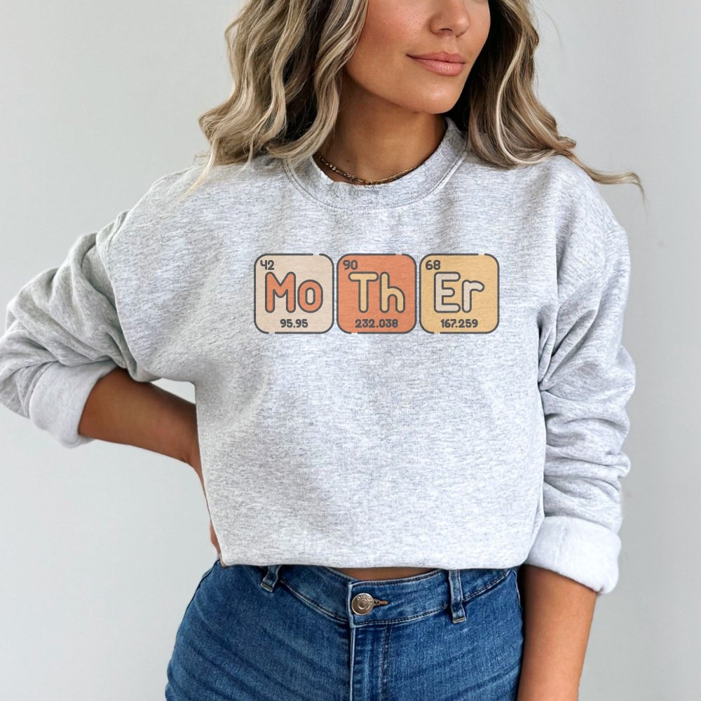 a woman wearing a sweatshirt with the words mother on it