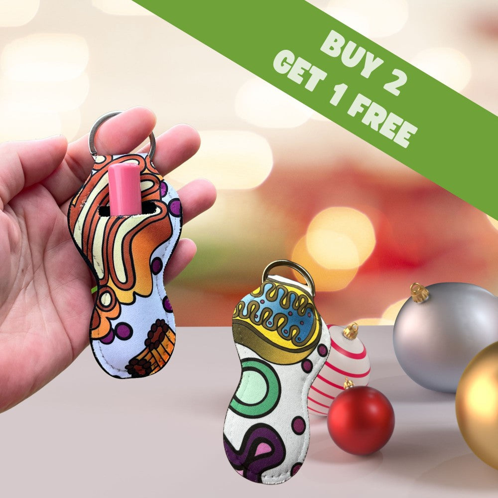 a hand holding a cell phone case next to a christmas ornament