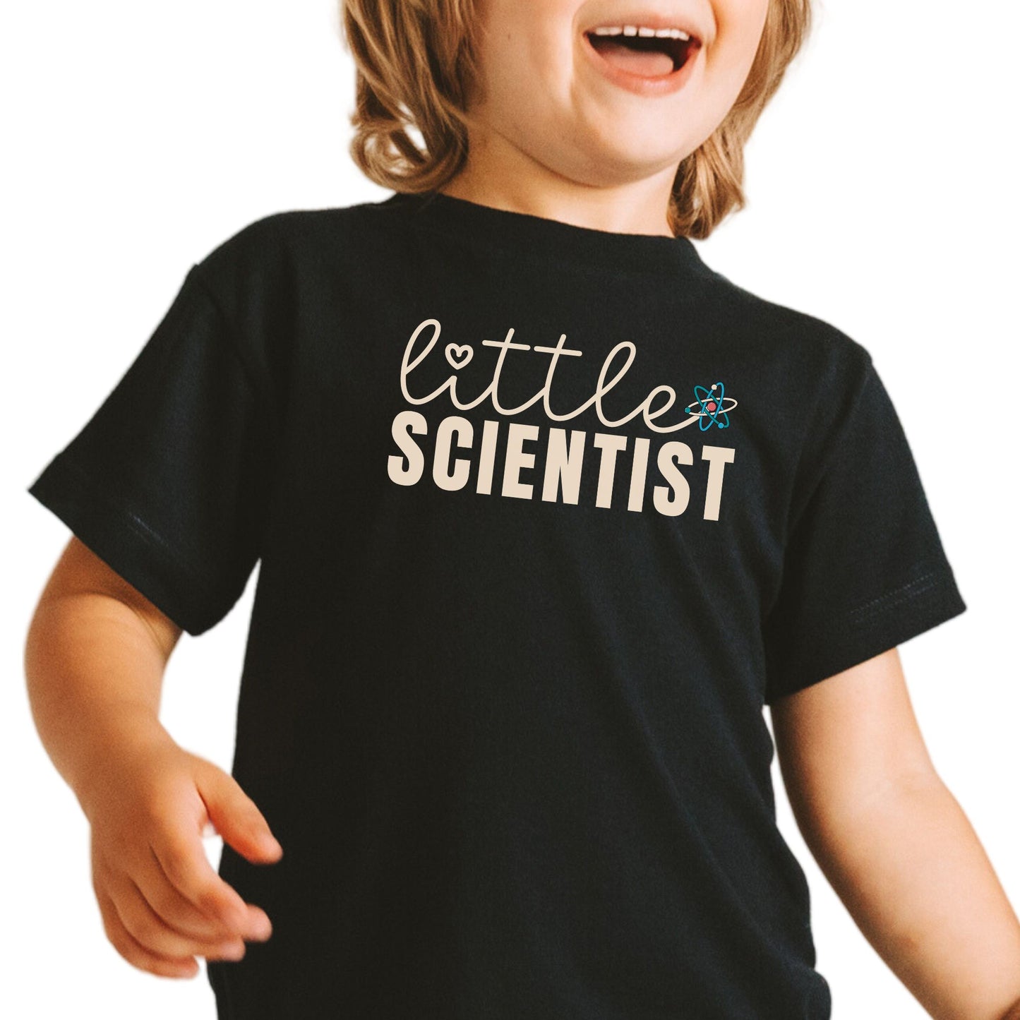 a little boy that is standing up with a smile on his face