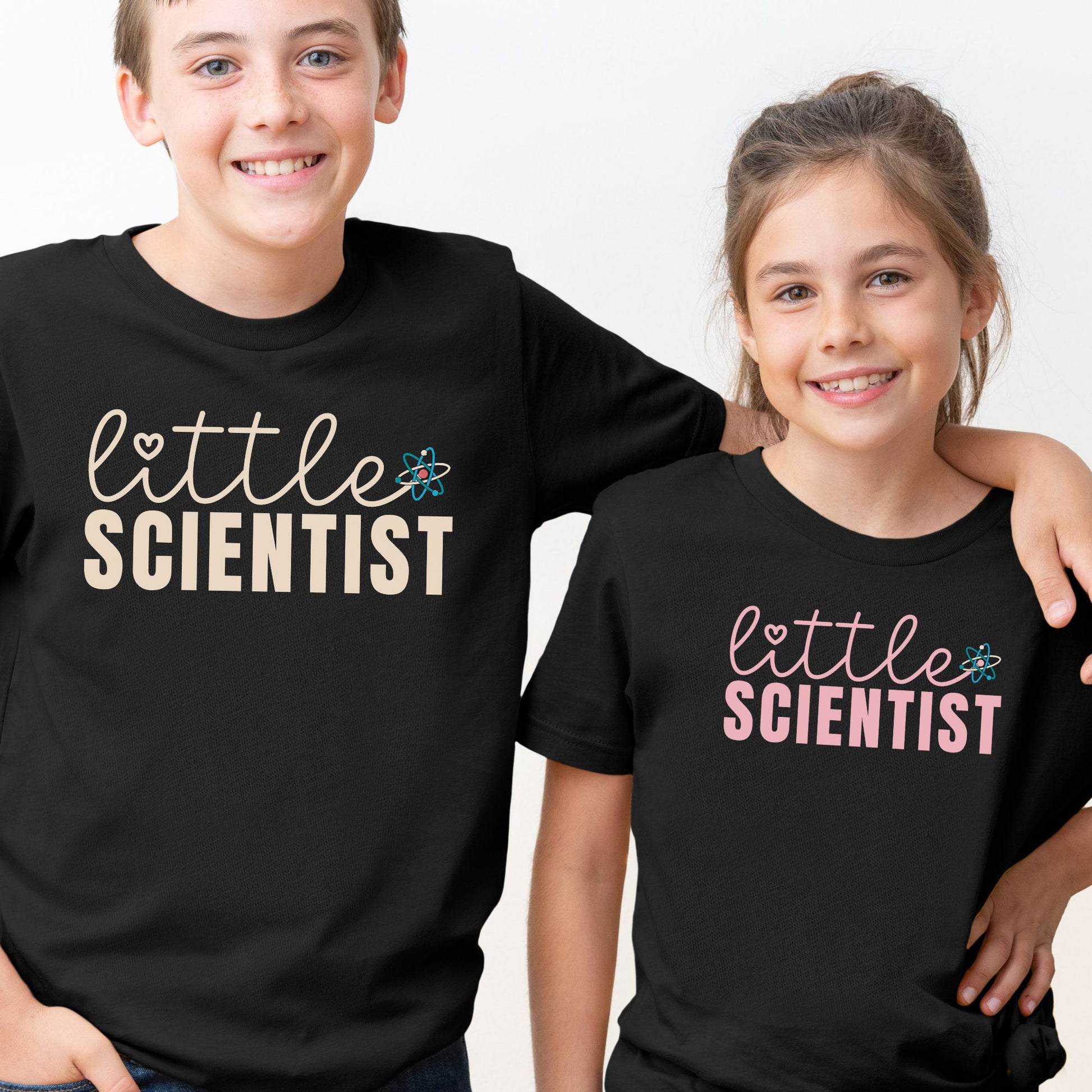 a couple of kids standing next to each other