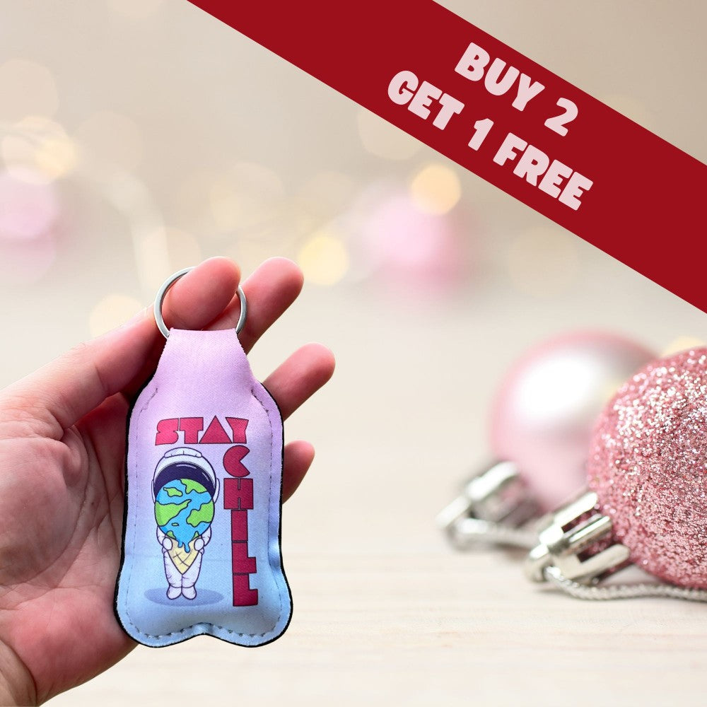 a hand holding a keychain with a picture of a cartoon character on it