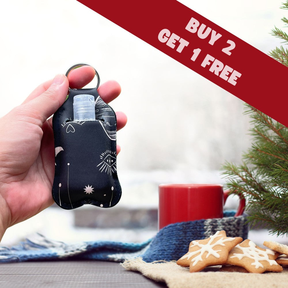 a person holding a cell phone in front of a christmas tree