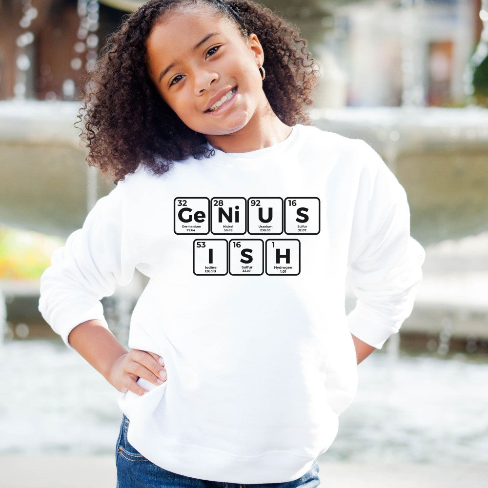 a young girl wearing a white sweatshirt that says genius is fish