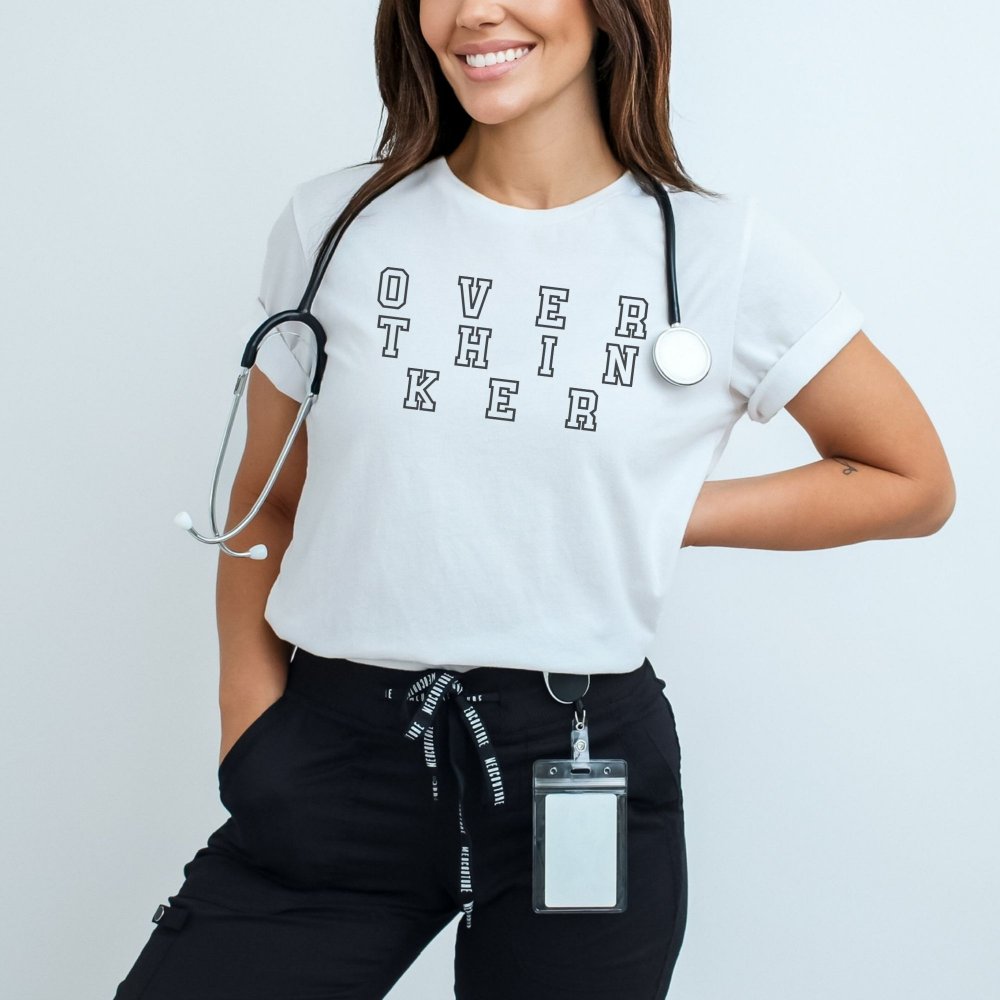 a woman wearing a white shirt with a stethoscope on it