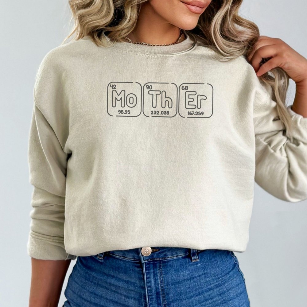 a woman wearing a sweatshirt with the word mother on it