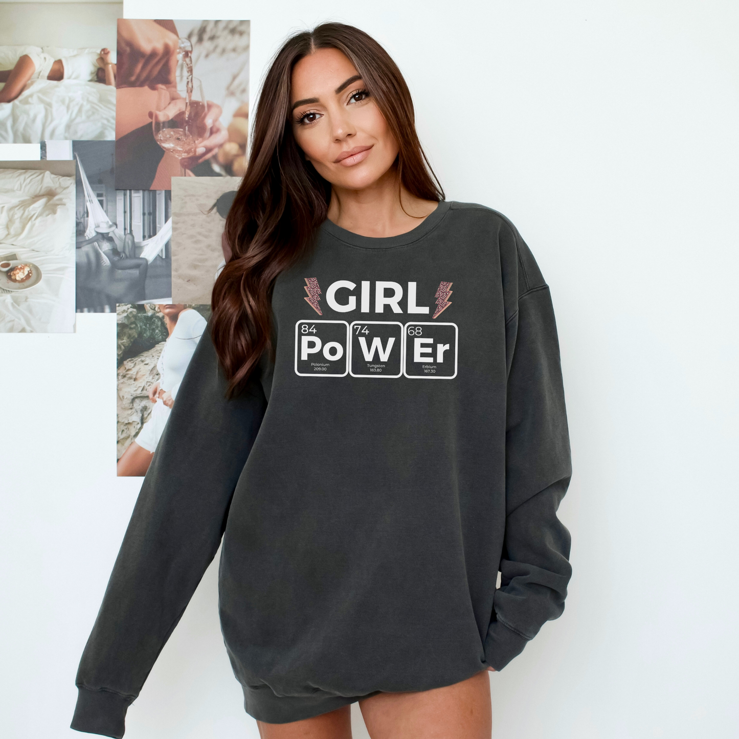 a woman wearing a sweatshirt that says girl power