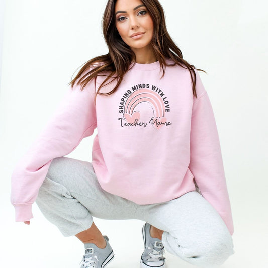 a woman in a pink sweatshirt is squatting down