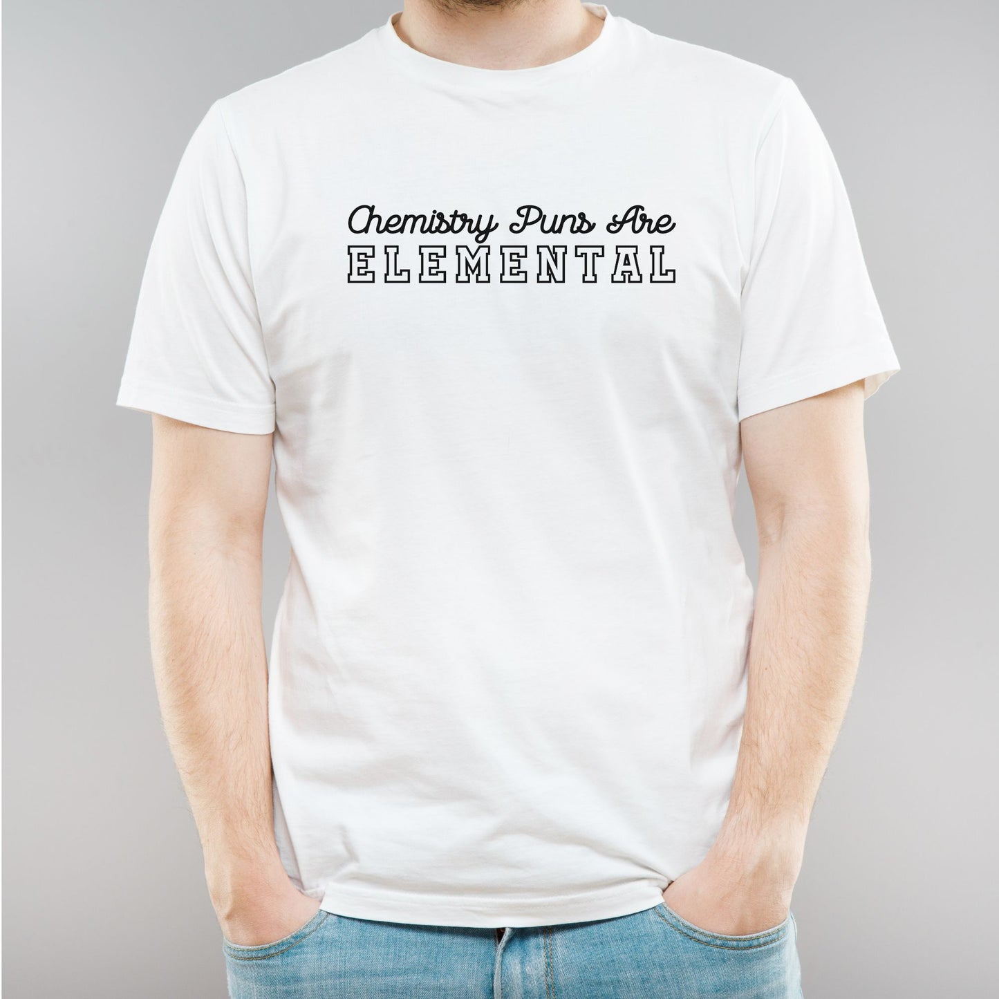 a man wearing a white t - shirt with the words,'elemental '