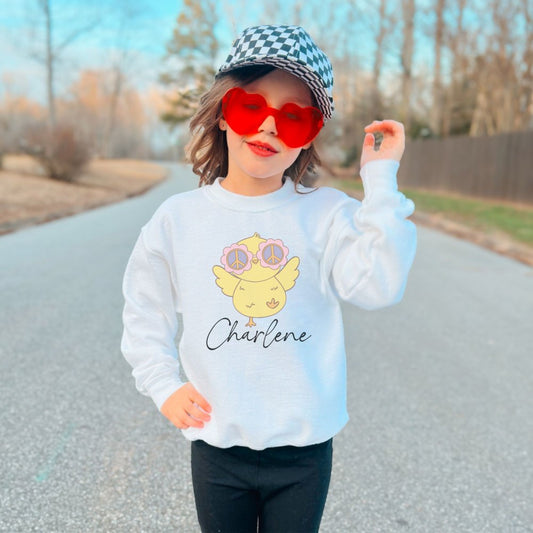 a little girl wearing sunglasses and a hat